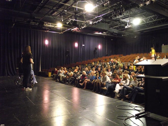 The crowd at the premiere of “Defining Beauty: Ms. Wheelchair America” at the Saugatuck Center for the Arts asks questions of director/producer Alexis Ostrander and film subject Amber Marcy Friday, June 10.