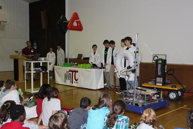 Submitted Photos 
Members of the Newton High School Robotics Team present their work at Green Hills Middle School.