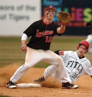 Fitch's Drew Doyle, right, slides safely onto second as Montville's Casey Zalagens, left, waits for the ball during a baseball game at Dodd Stadium in Norwich Saturday, April 16, 2011.