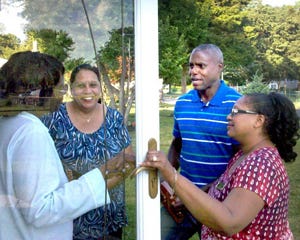 State Senate hopeful Carl Lewis (center) talks with Pemberton Township resident Emma Harper (left) while campaigning Monday night. Campaigning with Lewis were Pemberton Township Councilwoman Diane Stinney and freeholder candidate Machell Still-Pettis.