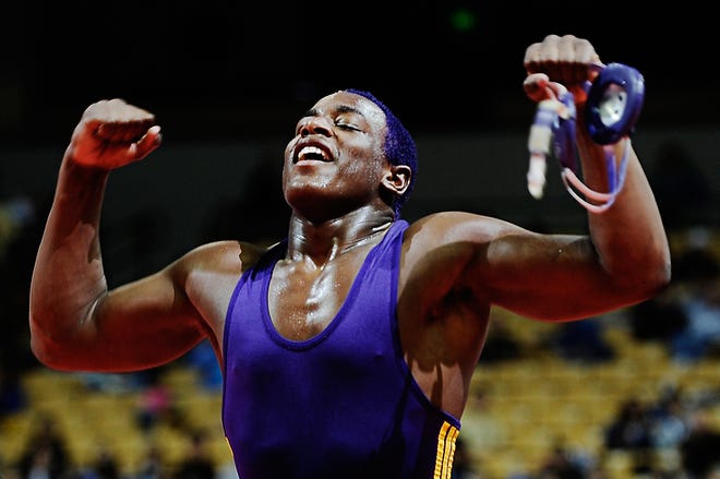 Hickman High School’s J’den Cox reacts after defeating Lee’s Summit West’s Benjamin Poeschl during the Class 4 215-pound state championship Feb. 19 at Mizzou Arena.