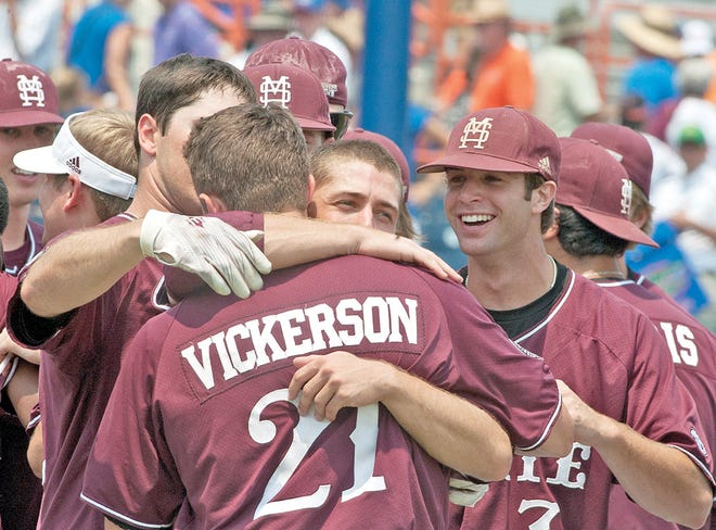 Mississippi State's Nick Vickerson is hugged by teammates after he hit the game-winning home run in the ninth inning against Florida during Saturday's Super Regional game in Gainesville. By PHIL SANDLIN, The Associated Press