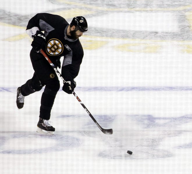 Bruins captain Zdeno Chara shoots during practice as Boston prepares to play the Canucks in Game 6 of the Stanley Cup finals.