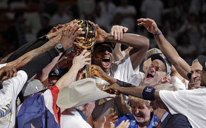 The Mavericks celebrate their first NBA title.
