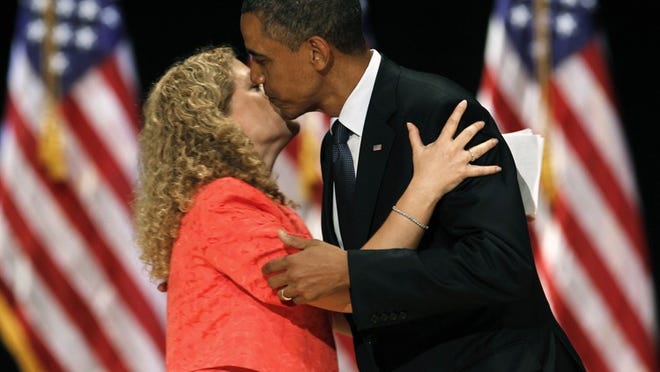 Rep. Debbie Wasserman Schultz, D-Fla., greets President Barack Obama after she introduced him before he spoke to a group of supporters at a Miami fundraiser, Monday, June 13, 2011.