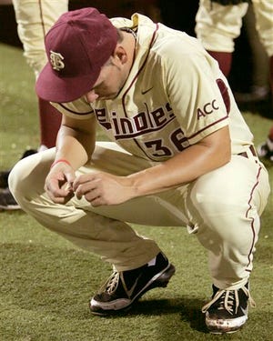 Florida State's Robby Scott, a senior, contemplates his last game at Dick Howser Stadium as Texas A&M won 11-2 in an NCAA super regional.