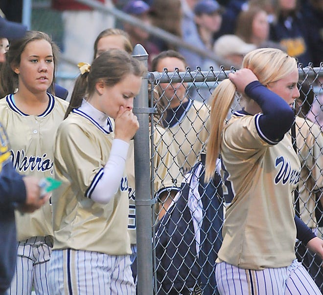 C-C catcher and four-year starter Katie Bumila (center) reacts after the final out was made in Monday's Division II South final game at Taunton High School. The Warriors lost, 6-0.