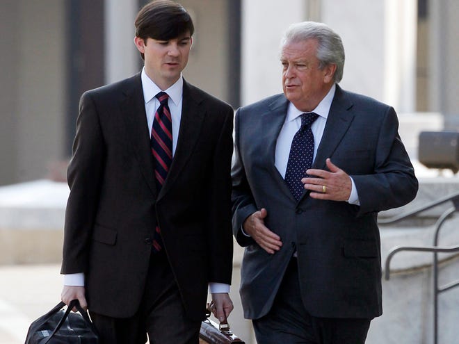 Victoryland casino owner Milton McGregor, right, talks with attorney Bill Espy as they arrive at the Federal Building in Montgomery Tuesday.