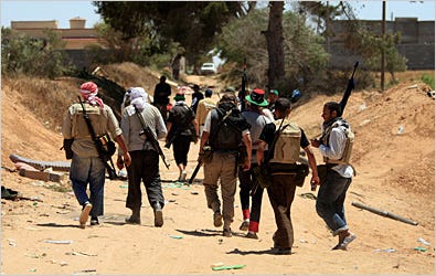 Rebel fighters on Monday following heavy clashes with pro-Qadaffi forces on the front line at Dafniya, about 25 miles west of Misurata, Libya.