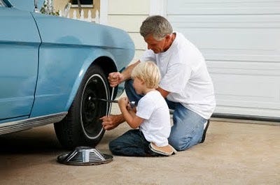 Dad fixing the car