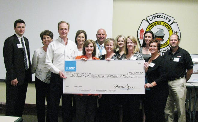 From left are Project Kidz Kove Board Members Jacob Waguespack, Gwen Molliere, BASF Geismar Site Manager and Senior Vice President Tom Yura, Board members Audrey Boudreaux, Erin Lanoux, Mark Boudreaux, Pam Cagnolatti, Krystal Swain, Stacey Bumpus, Jodi Loar, Stacey Parker and Mike Spillers.