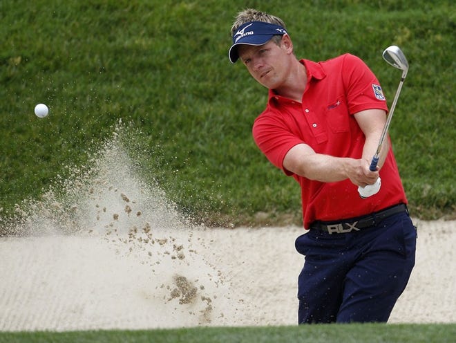 LUKE DONALD, the top-ranked player in the world, hits to the 11th green during a U.S. Open practice round on Tuesday.