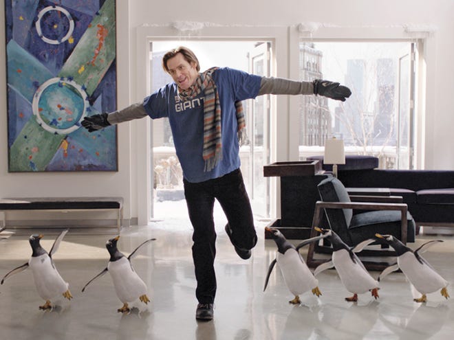 In this publicity image released by 20th Century Fox, Jim Carrey is shown in a scene from "Mr. Popper's Penguins."