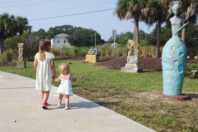 Brielle and Mesa Unsworth check out sculptures by local sculptor Thomas Glover in the St. Augustine Sculpture Garden at Lakeside Park, adjacent to the St. Augustine Beach City Hall. Admission is free.