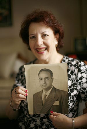 Wendy Wortzman of Randolph wrote and essay about her fond memories of her dad Frank Dantzig for Fathers Day. She is seen in family photos with her dad, and holding a photo of him on Tuesday June 14, 2011.