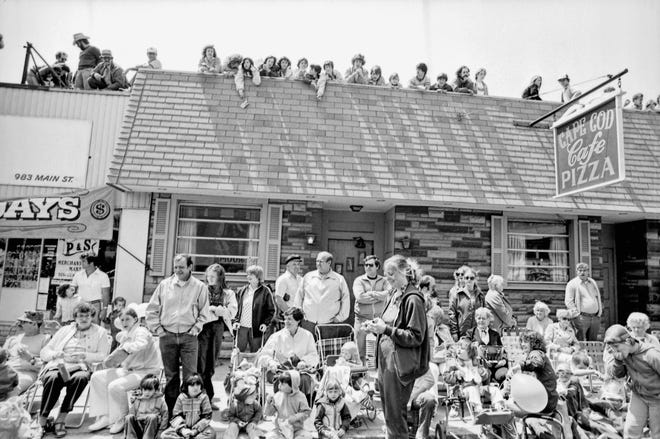 Spectators at Brockton's 1981 centennial parade watch from the roof of the Cape Cod Cafe.