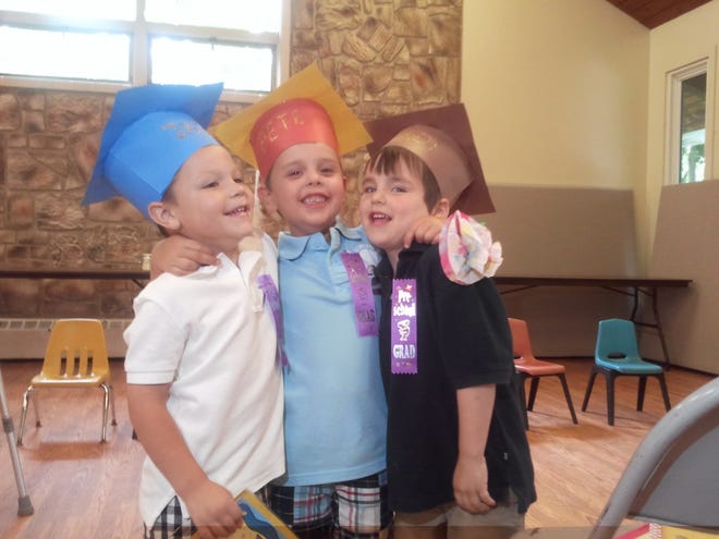 Jack Taylor, Peter May and Grady Idelson, all 4 and from Framingham, celebrate their graduation from Jonathan House Children's Center in Framingham on June 17, 2011.