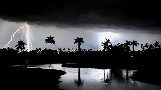 FILE PHOTO: Lightning storm rolls in near Bear Lakes Country Club golf course.