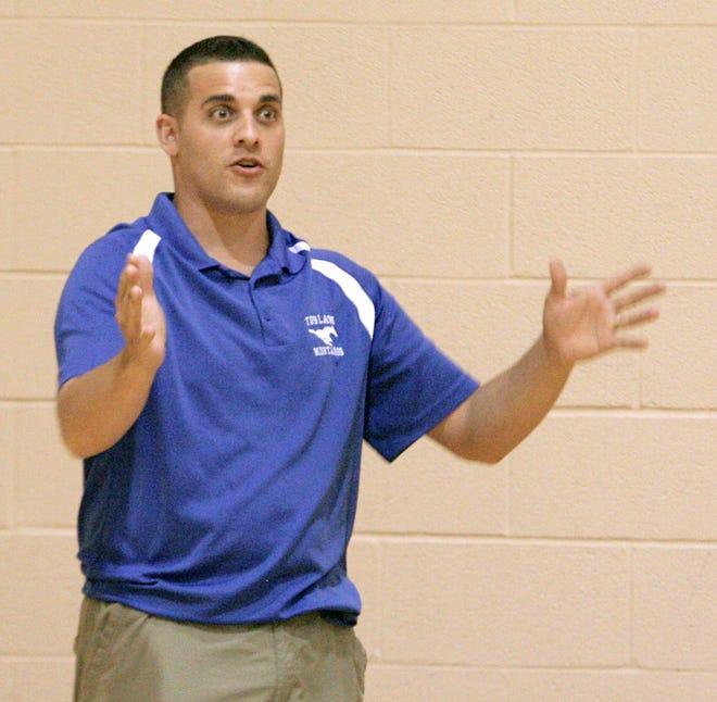 New Tuslaw basketball coach Kevin Lower motions to his team as the Mustangs played Perry in the J. Babe Stearn Summer League Tuesday at McKinley.