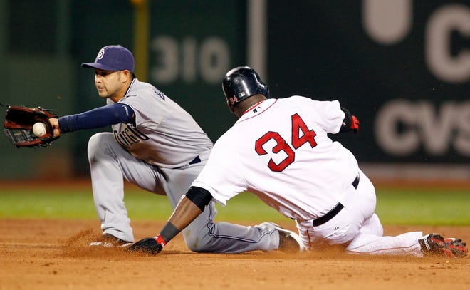 San Diego Padres shortstop Jason Bartlett gathers in a late throw as Boston Red Sox's David Ortiz steals second base during the fifth inning of a baseball game at Fenway Park in Boston on Tuesday, June 21, 2011. It was Ortiz's first steal since Aug. 8, 2008.