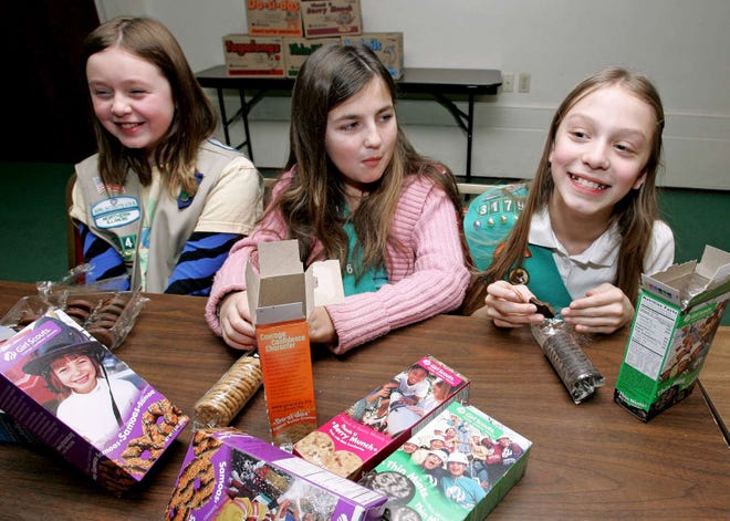 Girl Scouts Elora Chapman-Neal (from left), Megan Call and Dakota Kampmeier talk about their strategies for selling cookies Wednesday, Jan. 5, 2011, at the Girl Scouts of Northern Illinois Service Center in Rockford.