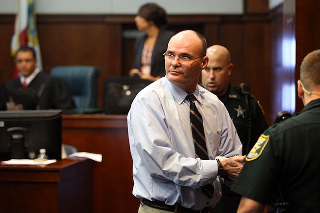 David Head scans the courtroom after being fingerprinted following a guilty verdict and being sentenced to life in prison by Circuit Judge Raul Zambrano on Tuesday, June 21, 2011.
