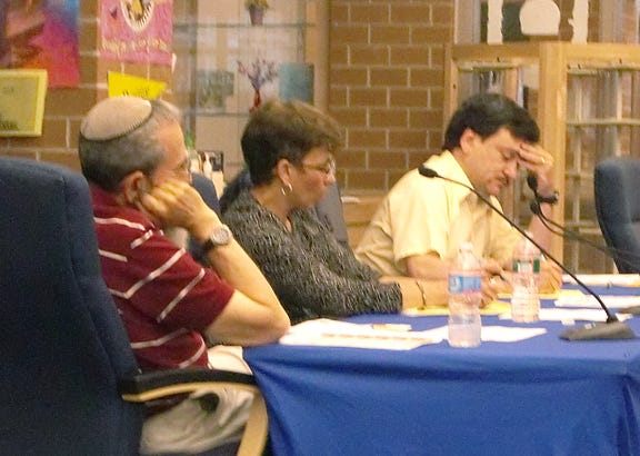 School Committee members Barry Cooperstein, left, Diane Huggon, center, and David Souza listen during Wednesday's Committee of the Whole meeting.