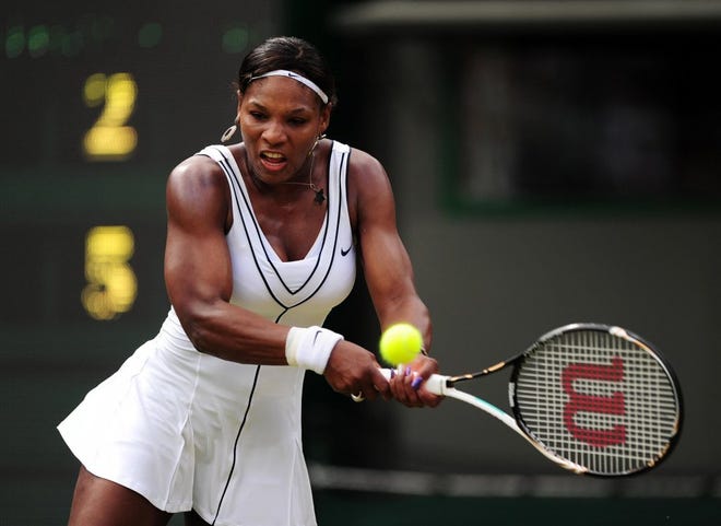 Serena Williams returns a shot to Russia's Maria Kirilenko during a third-round match at Wimbledon on Saturday.