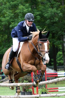 John Holmes on New Hope, Penn., riding Gideon to victory in the $25,000 Grand Prix event at the Fieldstone Equestrian in Halifax on Saturday, June 25, 2011.