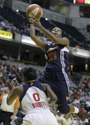 Connecticut Sun's Renee Montgomery puts up a shot against Indiana Fever's Shannon Bobbitt during the first half of a WNBA basketball game in Indianapolis, Saturday, June 25, 2011.