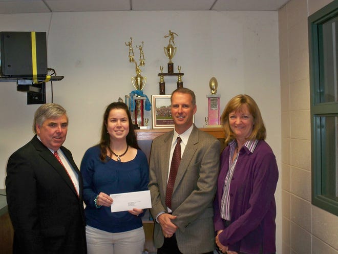 Norfolk County District Attorney Michael Morrissey, left, met recently with Millis High School senior class advisors Victoria Bartley and Robert Mullaney, and Millis High Principal and Superintendent Nancy Gustafson, to present a grant for the community’s safe graduation activities.
