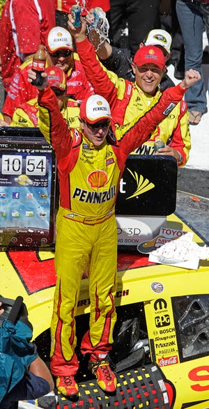Kurt Busch celebrates his win Sunday at Infineon Raceway in Sonoma, Calif. The Associated Press