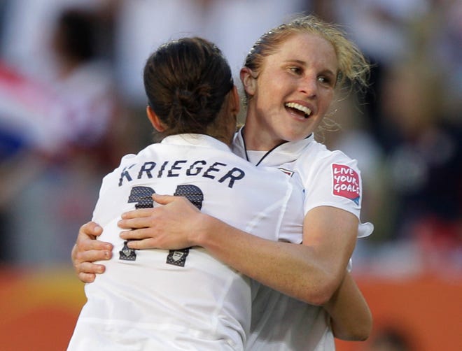 United States' Rachel Buehler is congratulated by her teammate United Alex Krieger after scoring the Americans' second goal during Tuesday's Women's World Cup match in Dresden, Germany.