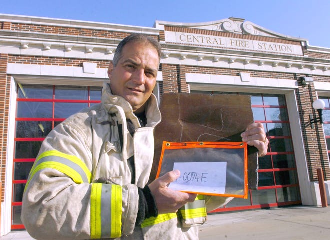 Middleboro Fire Chief Lance M. Benjamino holds a piece of steel recovered from the World Trade Center wreckage. The department will display it in tribute to the 343 firefighters who died while responding to the Sept. 11, 2001 terrorist attacks.