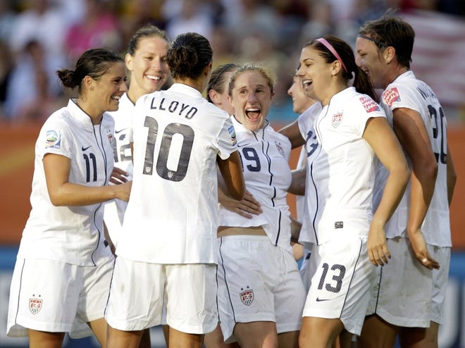 Rachel Buehler , center,  is congratulated by her teammates after scoring the second for the United States on Tuesday.
