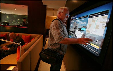 Wes Landsfeld of Fort Worth, using the GoBoard digital concierge at a Courtyard by Marriott in New York.