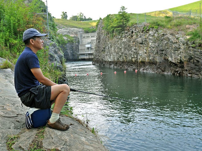 Hyosub Shin/AP
Hyung Seo of Duluth enjoys an afternoon of fishing near the Buford Dam water-release facility at Lower Pool Park in Buford.