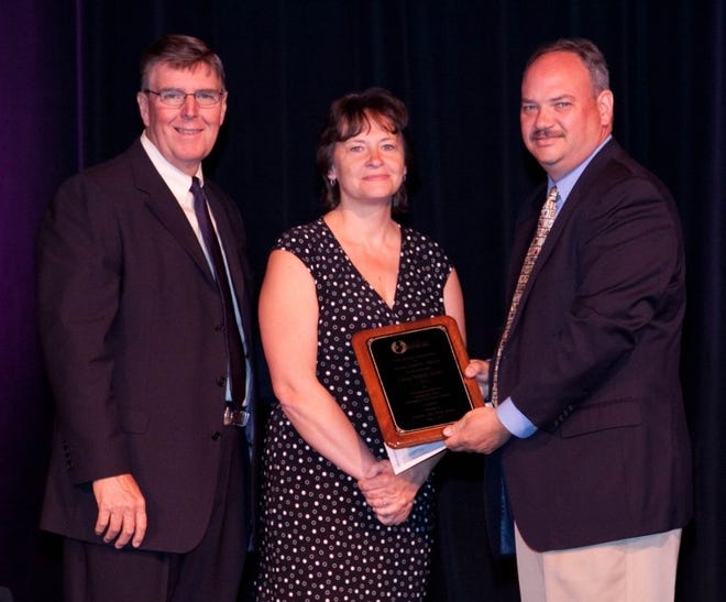 Burlington City School District Business Administrator Craig
Wilkie, right, accepts congratulations from representatives from
New Jersey Association of School Business Officials on being
awarded a NJASBO Distinguished Service Award for long-term,
continuous exemplary service. Pictured with Wilkie are Kateryna
Bechtel, business administrator of the Egg Harbor Township School
District, and NJASBO president and NJASBO executive director John
Donahue.