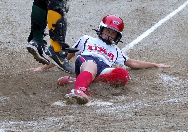 Courtesy photo
Lady Mavericks' Kaela Eichholz steals home during the ASA 12U girls' fast-pitch state softball tournament last weekend in Rochester.