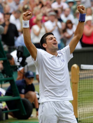 Novak Djokovic celebrates after defeating Jo-Wilfried Tsonga in Friday's men's semifinal at the All England Lawn Tennis Championships at Wimbledon.