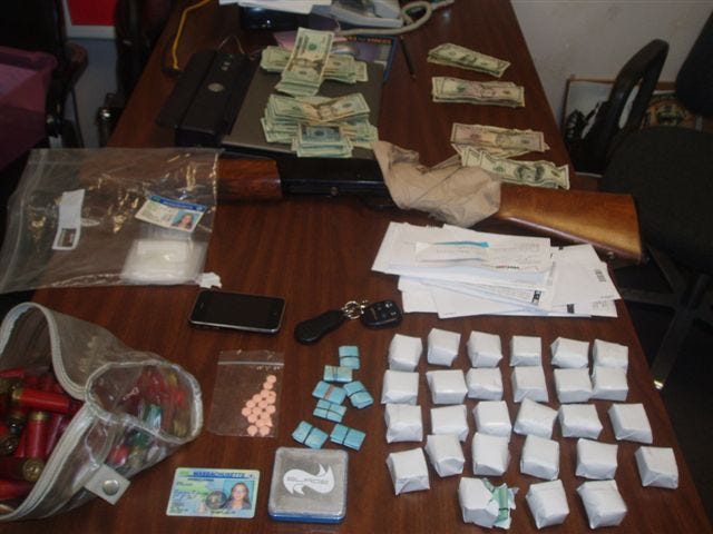 Drugs, firearms, cash and stolen goods were among the items seized by the Taunton Police Department during Friday’s drug bust of a married couple dealing heroin in Berkley.