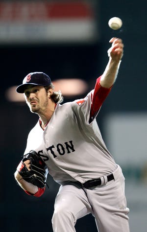 Boston Red Sox starting pitcher Andrew Miller throws during the first inning of an interleague baseball game against the Houston Astros, Saturday.