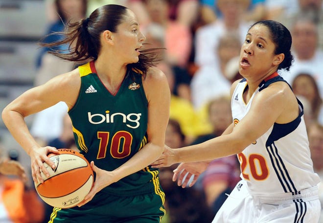 Seattle Storm's Sue Bird, left, is guarded by Connecticut Sun's Kara Lawson during the first half of a WNBA basketball game, Friday, July 1, 2011, in Uncasville, Conn.