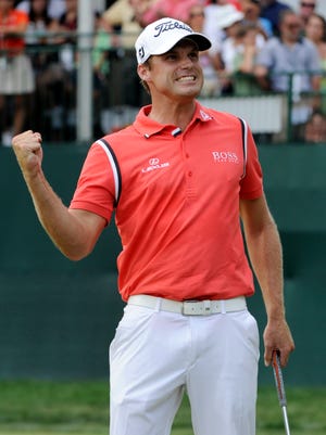 Nick Watney pumps his fist Sunday after winning the AT&T National at Aronimink Golf Club in Newtown Square, Pa. The Associated Press