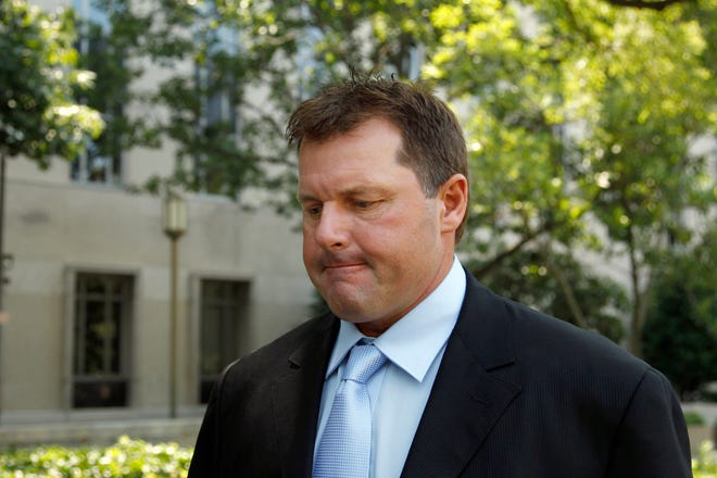 Roger Clemens leaves federal court in Washington on Tuesday. The Associated Press