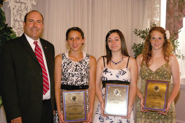 HUMANITARIANS OF THE YEAR: From left to right are Somerset Lions Club President John Cormier with award recipients Kelsie Lazaro, Angela Pavao and Cassie Prario.