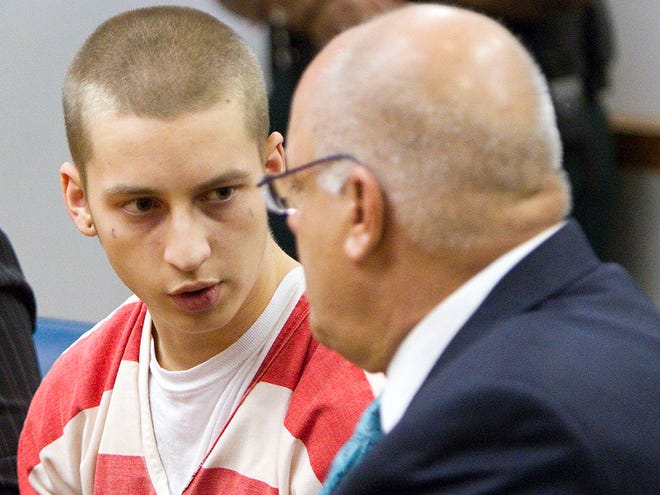 The state announced its plan to seek the death penalty against Michael Bargo, 19, left, the alleged gunman in the April, 2011 beating, shooting death and burning of Belleview teen Seath Jackson, Wednesday afternoon, July 6, 2011 at the Marion County Judicial Center in Ocala, FL. Bargo talks with his defense attorney, Charles Holloman, right, during the hearing.