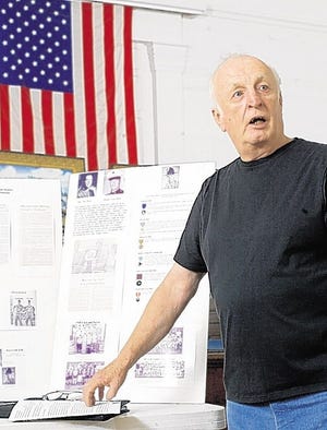Joe Devine talks about his old friend Marine Sgt. Robert Starbuck, who was killed in Vietnam in 1967, during an interview at the Village of Montgomery Museum on Thursday, May 21, 2009.