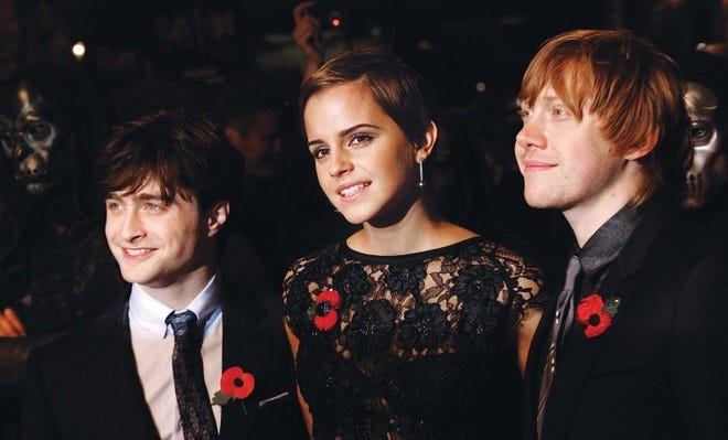 (From left) British actors Daniel Radcliffe, Emma Watson and
Rupert Grint arrive at a cinema in London's Leicester Square for
last fall's world premiere of ‘Harry Potter and the Deathly
Hallows: Part 1.’