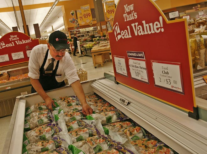 Deli Manager David Rizo works in the new frozen fish section of the recently remodeled Roche Bros. in Quincy.